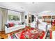 Bright living room features hardwood floors, large windows, and stylish furnishings at 356 20Th Ne Ave, St Petersburg, FL 33704