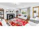 Bright living room features a fireplace, hardwood floors, and elegant furniture at 356 20Th Ne Ave, St Petersburg, FL 33704