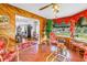 Cozy sunroom with wood paneling, tile floors, and bright, natural light at 356 20Th Ne Ave, St Petersburg, FL 33704