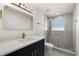 Updated bathroom featuring stylish vanity with gold fixtures and modern, tiled shower at 3709 Danny Bryan Blvd, Tampa, FL 33619