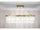 Close-up of a modern chandelier with crystal accents and gold hardware, adding elegance to the room at 3709 Danny Bryan Blvd, Tampa, FL 33619