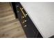 Close-up of a modern countertop with gold hardware and sleek, navy cabinetry at 3709 Danny Bryan Blvd, Tampa, FL 33619