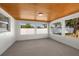 Bright, airy sunroom with wood-paneled ceiling and large windows overlooking the backyard at 3709 Danny Bryan Blvd, Tampa, FL 33619