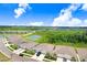 Aerial view showing community ponds, manicured lawns, and landscaping at 3719 Stormy Thistle Pl, Plant City, FL 33565