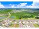 Aerial view showcases the community's lush landscaping, manicured lawns, and serene ponds at 3719 Stormy Thistle Pl, Plant City, FL 33565