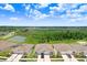 Aerial view featuring the community's lush landscaping, manicured lawns, and serene ponds at 3719 Stormy Thistle Pl, Plant City, FL 33565
