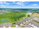 Aerial view featuring the community's lush landscaping, manicured lawns, and serene ponds at 3719 Stormy Thistle Pl, Plant City, FL 33565