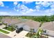 Aerial view showcasing the community featuring well-manicured lawns, landscaping, and serene ponds at 3719 Stormy Thistle Pl, Plant City, FL 33565