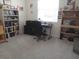Bright bedroom features a large desk, office chair, and bookcases filled with books and decor at 3719 Stormy Thistle Pl, Plant City, FL 33565