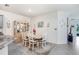 Cozy dining area adjacent to the kitchen, featuring a china cabinet and a table with seating for six at 3719 Stormy Thistle Pl, Plant City, FL 33565