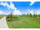 Community dog park with green space, fencing, and a welcome sign at 3719 Stormy Thistle Pl, Plant City, FL 33565