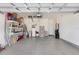 Spacious garage with epoxy flooring and ample storage and workspace at 3719 Stormy Thistle Pl, Plant City, FL 33565