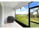 Relax on this screened patio and enjoy the view of the lush green lawn, trees, and beautiful lake at 3719 Stormy Thistle Pl, Plant City, FL 33565