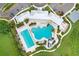 Aerial shot of the community pool area featuring a slide, lounge chairs, and ample space at 3719 Stormy Thistle Pl, Plant City, FL 33565