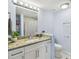 Bathroom featuring granite counters, updated cabinets, and modern fixtures at 4017 Cedar Limb Ct, Tampa, FL 33614