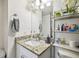 Bathroom featuring a white vanity with granite countertop and stylish storage at 4017 Cedar Limb Ct, Tampa, FL 33614