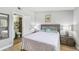 Well-lit bedroom with en suite bathroom entrance and stylish decor at 4017 Cedar Limb Ct, Tampa, FL 33614
