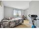 Bedroom with laminate floors, large window, and closet at 4017 Cedar Limb Ct, Tampa, FL 33614