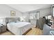 Bright bedroom featuring hardwood floors, gray walls, and a serene atmosphere at 4017 Cedar Limb Ct, Tampa, FL 33614