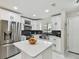 Bright kitchen with white cabinets, stainless steel appliances, and a center island at 4017 Cedar Limb Ct, Tampa, FL 33614