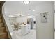 Spacious open-concept living and kitchen area with updated appliances, modern floors, and ample natural light at 4017 Cedar Limb Ct, Tampa, FL 33614
