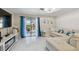 Inviting living room with large sliding glass doors, modern decor, and a comfortable sofa at 4017 Cedar Limb Ct, Tampa, FL 33614