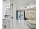 Open living space with modern tile floors, sliding glass doors, and contemporary finishes at 4017 Cedar Limb Ct, Tampa, FL 33614