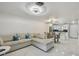 Open-concept living room and kitchen area, with modern finishes and ample natural light at 4017 Cedar Limb Ct, Tampa, FL 33614