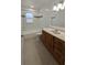 This bathroom features tile and a combination bathtub and shower. It includes a sink with cabinetry at 4021 19Th N St, St Petersburg, FL 33714
