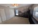 Cozy bedroom with ceiling fan and scenic forest-themed mural feature wall at 4021 19Th N St, St Petersburg, FL 33714