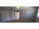 A bedroom featuring a ceiling fan, carpet, and double closets, providing storage space at 4021 19Th N St, St Petersburg, FL 33714