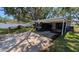 Home exterior featuring covered parking and an electric vehicle charging in the driveway at 4021 19Th N St, St Petersburg, FL 33714