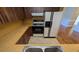 Galley kitchen showcasing wood cabinets, laminate countertops, an electric range, and a white refrigerator at 4021 19Th N St, St Petersburg, FL 33714
