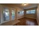 Bright living area featuring hardwood flooring and a doorway to the patio at 4021 19Th N St, St Petersburg, FL 33714