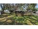 The spacious yard is shaded by mature trees and partially fenced in at 4021 19Th N St, St Petersburg, FL 33714