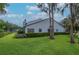Well-manicured lawn in backyard with mature trees and trimmed hedges enhancing privacy at 4234 Brentwood Park Cir, Tampa, FL 33624