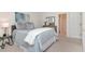 Bright bedroom with plush carpet, modern decor, and a closet for storage at 4234 Brentwood Park Cir, Tampa, FL 33624