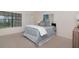 Bright bedroom with plush carpet, modern decor, and a closet for storage at 4234 Brentwood Park Cir, Tampa, FL 33624