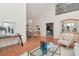 Open floor plan, dining room with hardwood floors, and natural light, ideal for Gathering meals at 4234 Brentwood Park Cir, Tampa, FL 33624