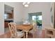 Dining room featuring hardwood floors, open access to the kitchen and natural light, perfect for gatherings at 4234 Brentwood Park Cir, Tampa, FL 33624