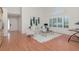 Inviting living room with hardwood floors, natural light, and stylish décor, creating a comfortable ambiance at 4234 Brentwood Park Cir, Tampa, FL 33624
