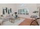 Cozy living room with hardwood floors, white walls, and bright natural light, creating a comfortable space at 4234 Brentwood Park Cir, Tampa, FL 33624