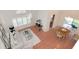 Open living and dining area with hardwood floors, fan, and dining set at 4234 Brentwood Park Cir, Tampa, FL 33624