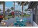 Charming outdoor patio with comfortable seating and lush tropical landscaping at 4234 Brentwood Park Cir, Tampa, FL 33624
