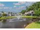 Water fountain on a large pond surrounded by residential buildings in a manicured community at 4234 Brentwood Park Cir, Tampa, FL 33624