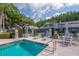 Relaxing community pool area with lounge chairs and well-maintained landscaping at 4234 Brentwood Park Cir, Tampa, FL 33624