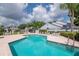 Large community pool with ample seating and manicured landscaping for relaxing afternoons at 4234 Brentwood Park Cir, Tampa, FL 33624