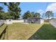 Expansive backyard with a well-maintained lawn and storage shed, offering ample space for recreation and storage at 4521 W North St, Tampa, FL 33614