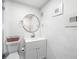 Bright, updated bathroom with modern fixtures, white vanity, and neutral finishes at 4521 W North St, Tampa, FL 33614