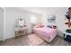 Cozy bedroom with a vanity table, plush accents and whimsical decor at 4521 W North St, Tampa, FL 33614